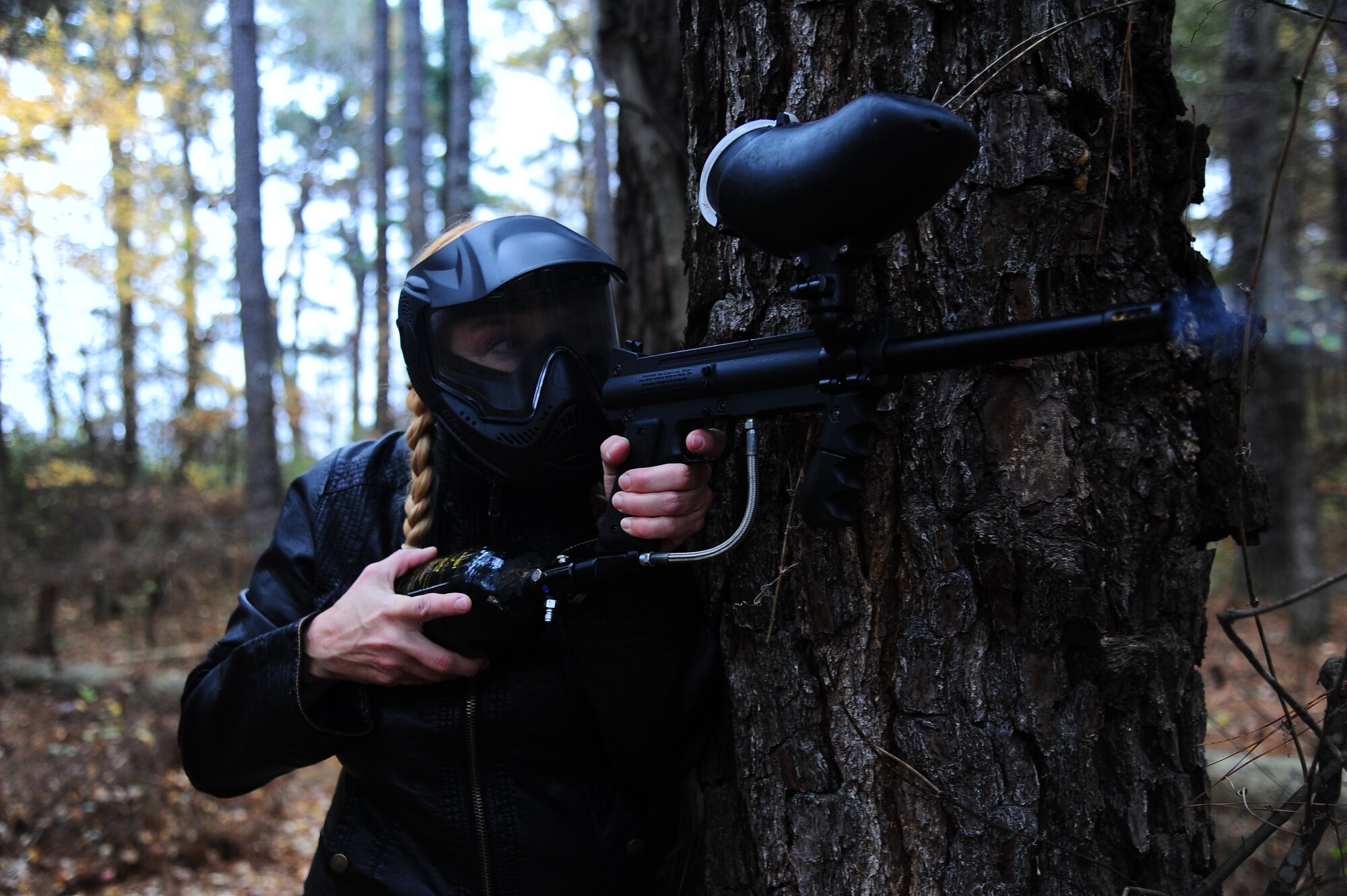 Linda Norman, 14th Force Support Squadron, fires a paintball at the new paintball course Nov. 22 on Columbus Air Force Base. The new paintball course is now located behind Outdoor Recreation, for more information please call 434-2507.
