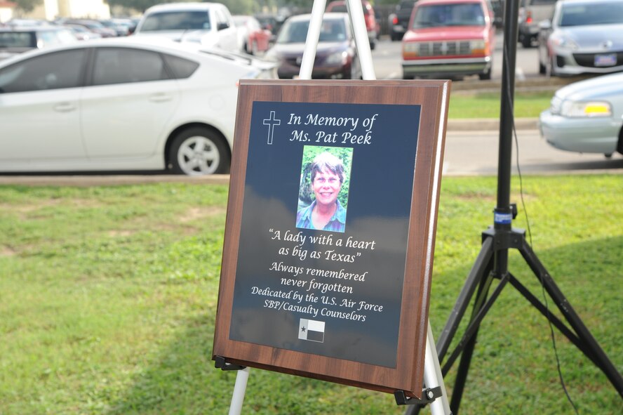 A tree and plaque dedication ceremony honoring Patricia Peek was held Sept. 26 outside the Air Force Personnel Center at Joint Base San Antonio-Randolph, Texas. Peek was chief of Air Force Retiree Services until her death Nov. 24, 2012, at age 68.  She was a 30-year civil servant with the center and a force behind the Afterburner; an expert on the Survivor Benefit Plan; the backbone of the Air Force Retiree Council; and a staunch supporter of Retiree Activities Offices worldwide. (U.S. Air Force photo)