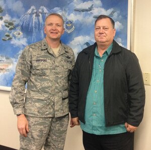 Col. Darren Hartford, 437th Airlift Wing commander, and Kim Lilly, the 2013 Air Mobility Command Outstanding Safety Civilian of the Year. (U.S. Air Force photo/Capt. Michael Recker)