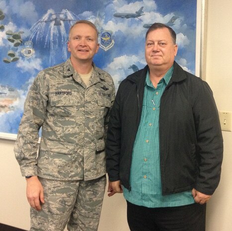 Col. Darren Hartford, 437th Airlift Wing commander, and Kim Lilly, the 2013 Air Mobility Command Outstanding Safety Civilian of the Year. (U.S. Air Force photo/Capt. Michael Recker)