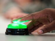 131121-F-JW079-122
Senior Airman William Shelby, 90th Force Support Squadron fitness specialist, signals he knows an answer during the question and answer round of Freedom Hall Fitness Center’s Fitness Specialist Challenge Nov. 21. Five teams vied for the title of top fitness specialist on F.E. Warren. (U.S. Air Force photo by R.J. Oriez)