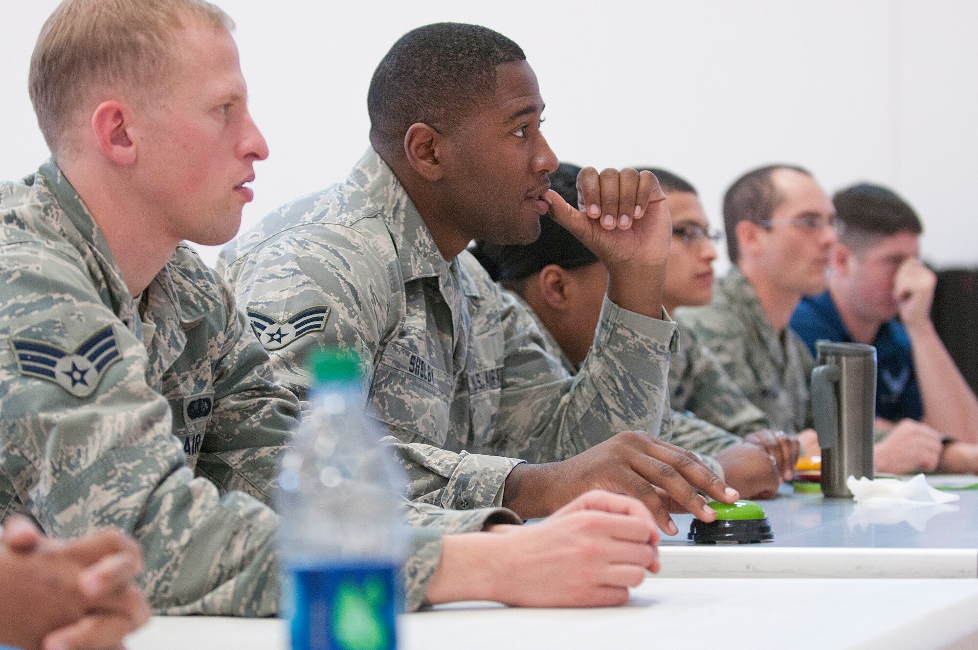 131121-F-JW079-104
Teammates Senior Airmen Mark Currell and William Shelby compete against other teams of 90th Force Support Squadron fitness specialists Nov. 21 during the question and answer round of Freedom Hall Fitness Center's Fitness Specialist Challenge. Master Sgt. Jessica Cambron, 90th FSS fitness superintendent, thought of the competition as way to build moral among the fitness staff and to help motivate her Airmen to familiarize themselves with the Air Force instructions they use in doing their jobs. (U.S. Air Force photo by R.J. Oriez)
