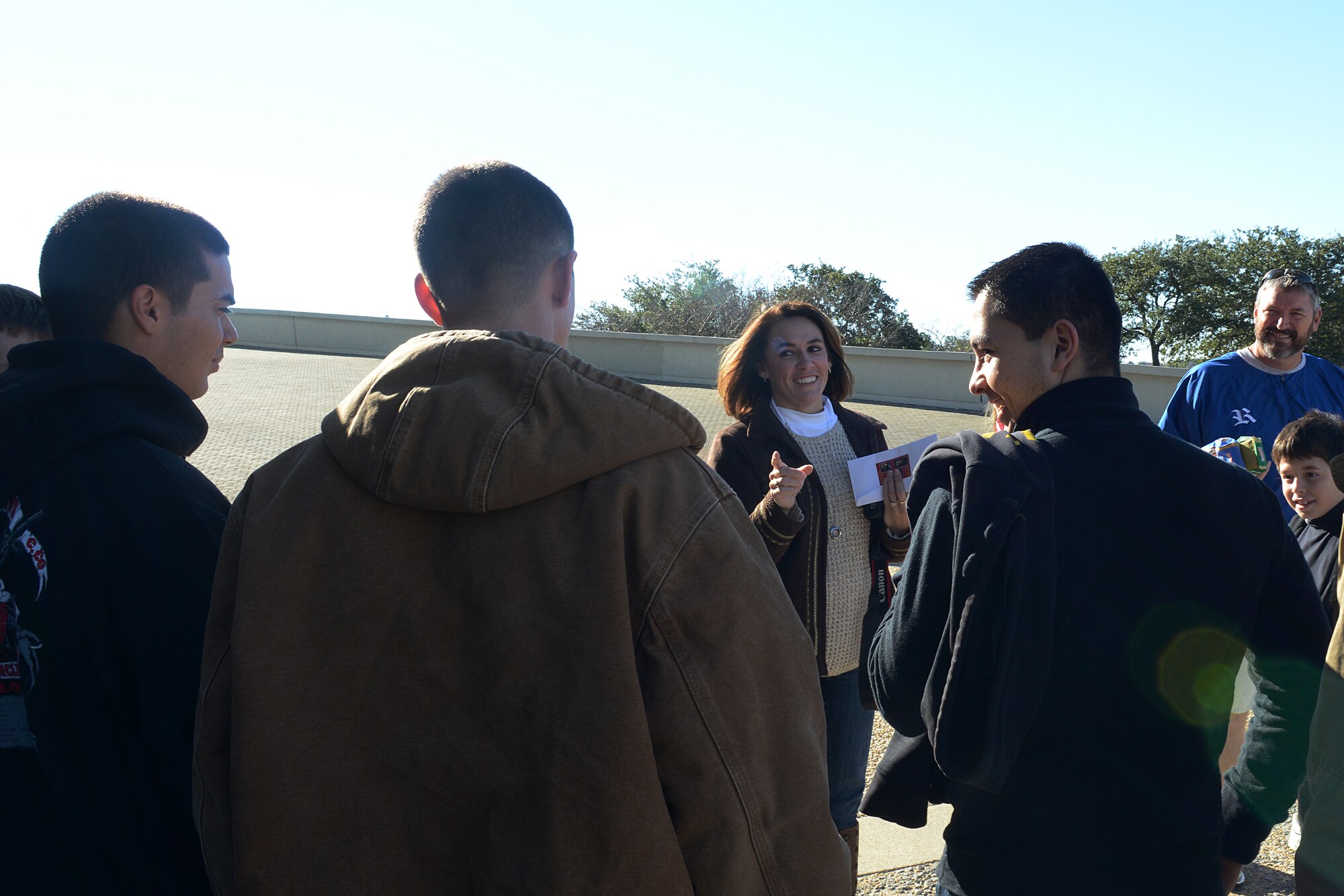 April Griffin, a local community member, and her family meet U.S. Army Advanced Individual Training Soldiers from the 1st Battalion, 222nd Aviation Regiment at the Hampton Coliseum at Hampton, Va., Nov. 28, 2013, during the “Adopt-A-Service Person” program. Griffin’s family has “adopted” Service members for more than 20 years. (U.S. Air Force photo by Airman 1st Class Kimberly Nagle/Released) 