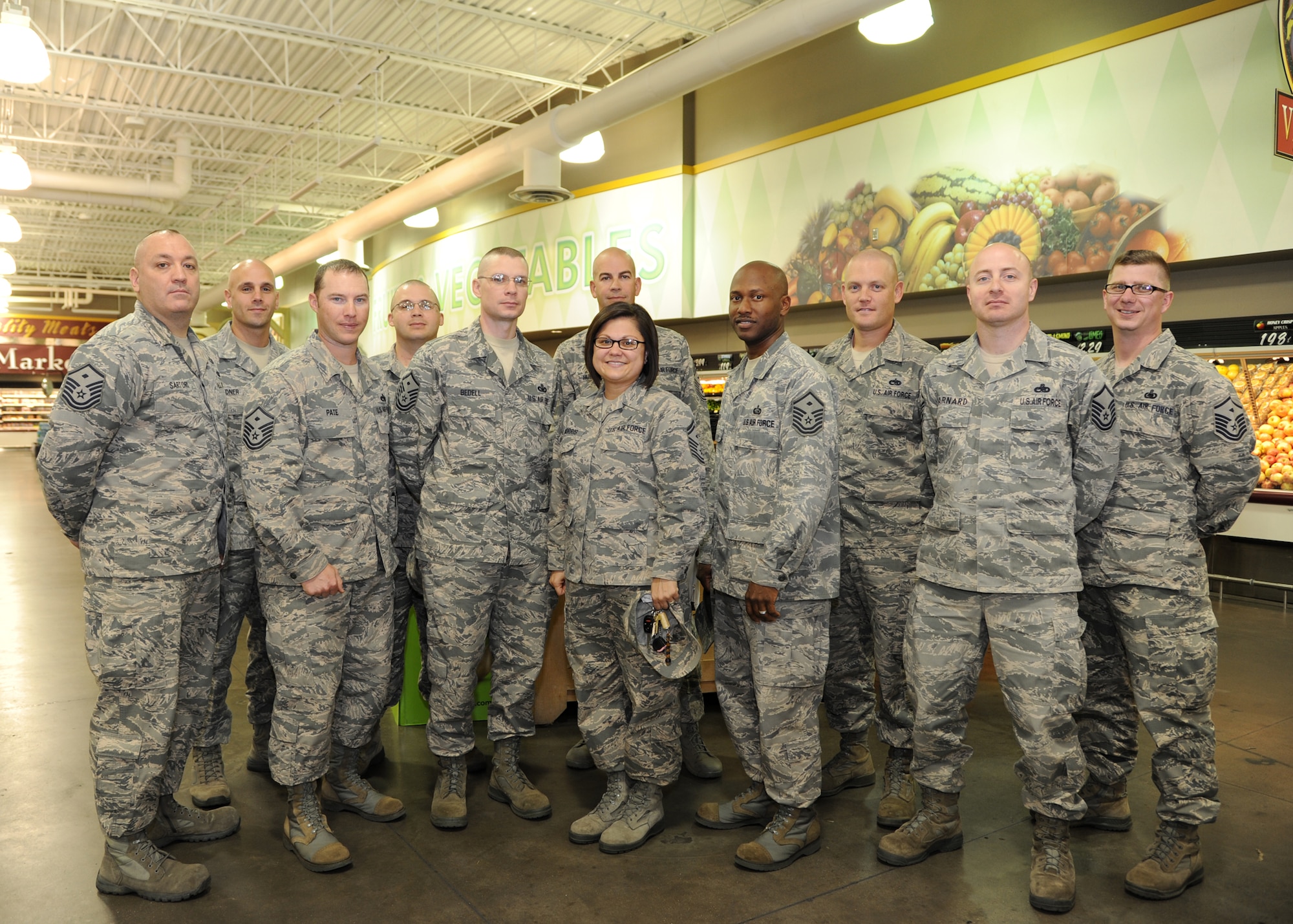 Barksdale first sergeants pose for a group photo at the Commissary on Barksdale Air Force Base, La., Nov. 7, 2013. On separate occasions during the month of November, first sergeants randomly passed out gift cards to Airmen and their families. (U.S. Air Force photo/Senior Airman Joseph A. Pagán Jr.)