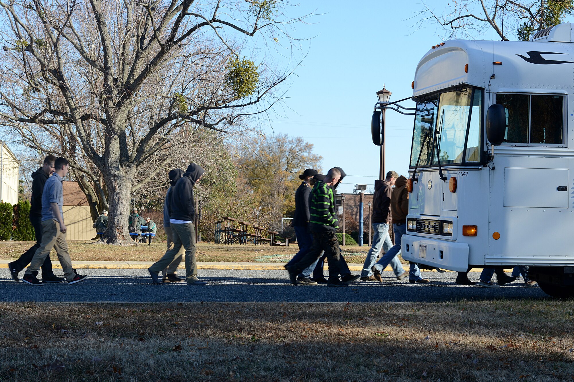 U.S. Army Advanced Individual Training Soldiers from the 1st Battalion, 222nd Aviation Regiment at Fort Eustis board a bus headed to the Hampton Coliseum in Hampton, Va., to be “adopted” out to local families for Thanksgiving dinner as part of the “Adopt-A-Service Person” program, Nov. 28, 2013. The program gave 169 Soldiers the opportunity to join local families for the holiday. (U.S. Air Force photo by Airman 1st Class Kimberly Nagle/Released) 