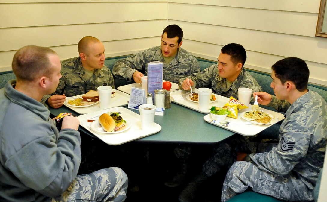 Due to the demands of duty, many Airmen are unable to make it home for the holidays. While demonstrating the U.S. Air Force’s “wingman concept” is always a priority, it is especially significant during the holidays and goes a long way toward promoting a sense of family among Airmen. To help foster a sense of camaraderie for those unable to go home during the season, Joint Base Langley-Eustis hosts several events, including holiday meals at the dining facilities. (U.S. Air Force photo by Staff Sgt. Wesley Farnsworth/Released)

