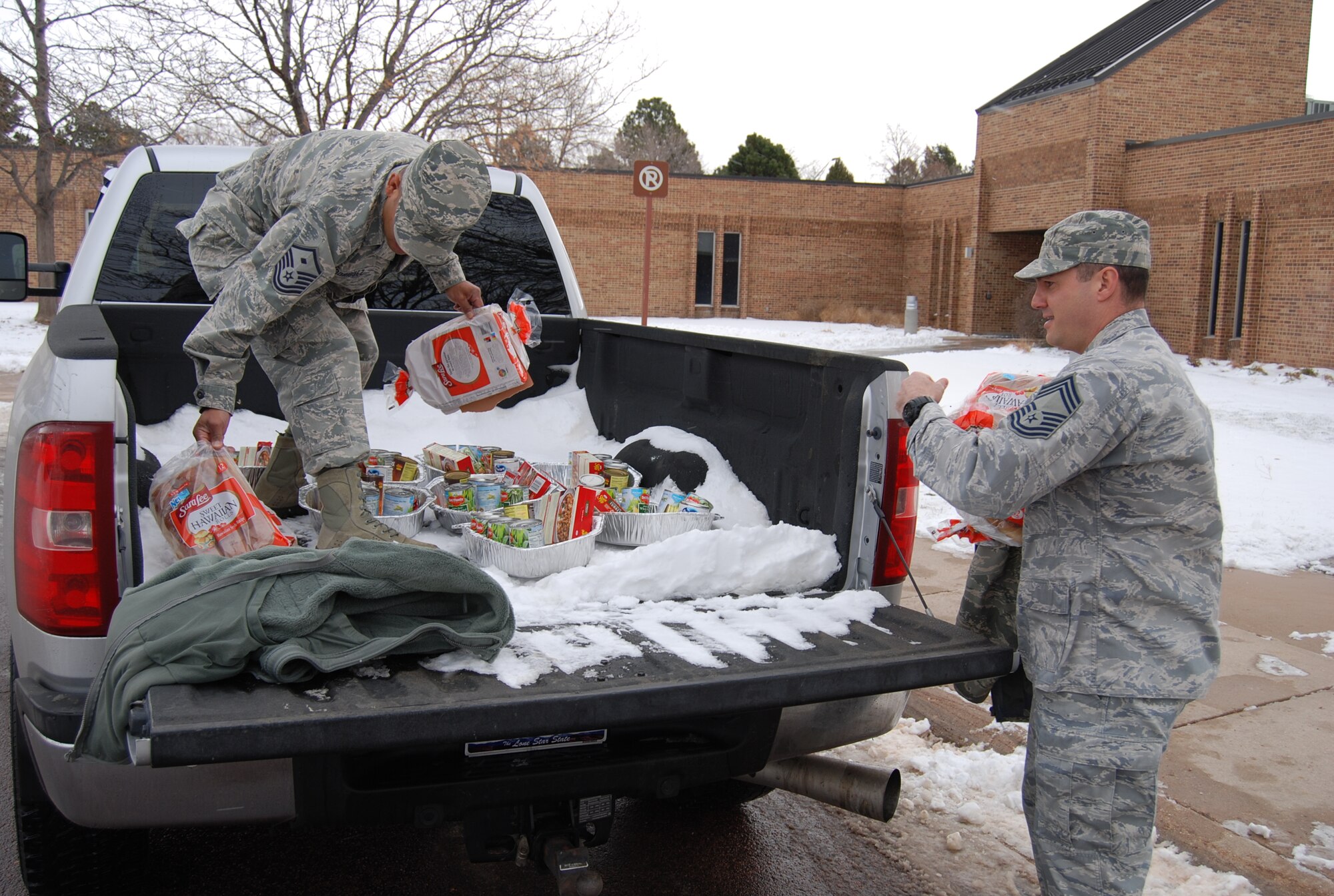 PETERSON AIR FORCE BASE, Colo. – Members of the Peterson Diamond Council, commissary, local vendors and parishioners at the base chapel raised about $8,900 in donations and funds to fill 233 Thanksgiving baskets to give to Peterson military families. Along with the basket, which included all the fixings and sides, members received a $25 commissary gift card to purchase the main course of their choosing. Unit representatives identified 233 families who could benefit from the assistance and worked with the Peterson Diamond Council to help them enjoy the holiday, regardless of rank, unit or branch of service. (U.S. Air Force photo/Michael Golembesky)