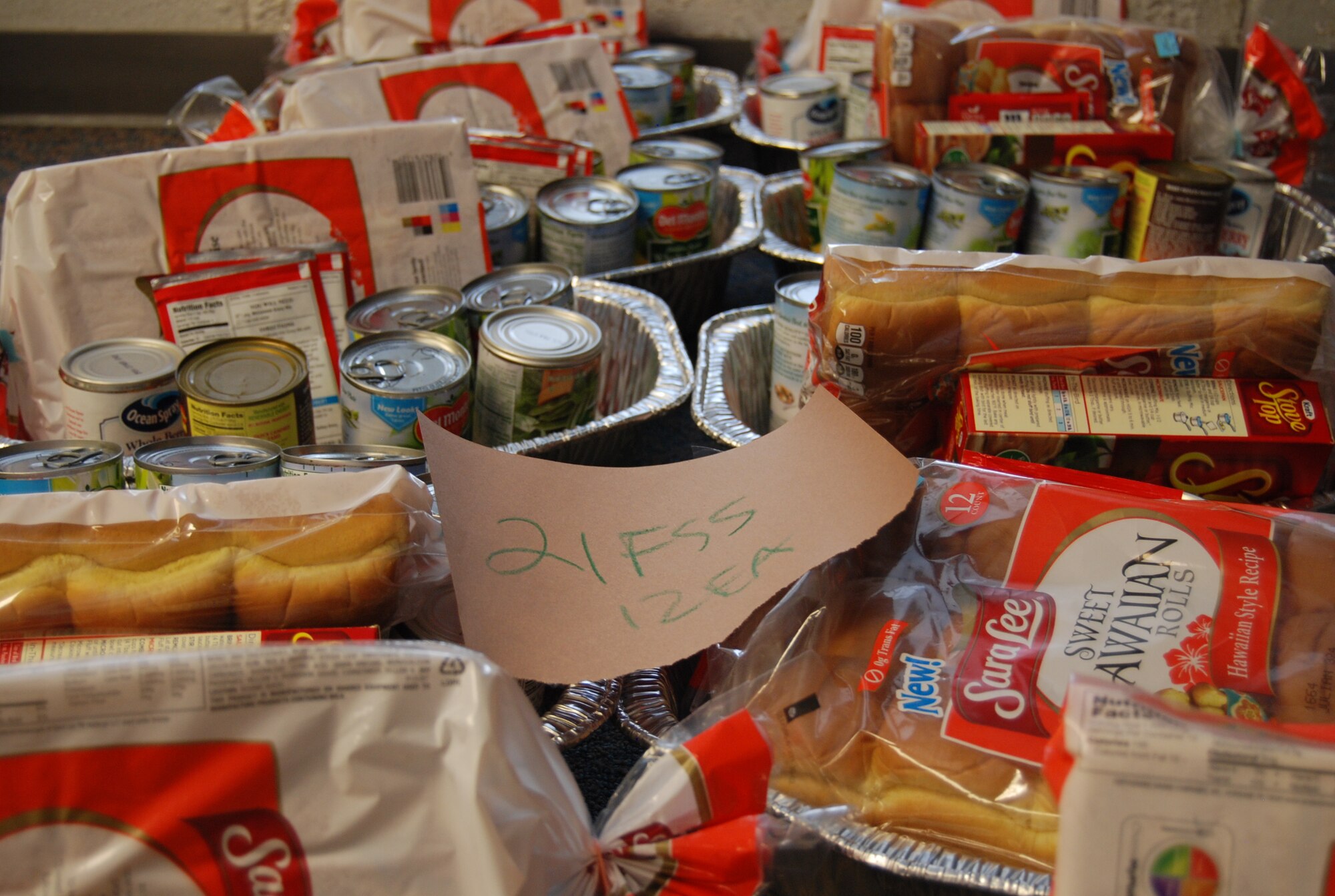 PETERSON AIR FORCE BASE, Colo. – Members of the Peterson Diamond Council, commissary, local vendors and parishioners at the base chapel raised about $8,900 in donations and funds to fill 233 Thanksgiving baskets to give to Peterson military families. Along with the basket, which included all the fixings and sides, members received a $25 commissary gift card to purchase the main course of their choosing. Unit representatives identified 233 families who could benefit from the assistance and worked with the Peterson Diamond Council to help them enjoy the holiday, regardless of rank, unit or branch of service. (U.S. Air Force photo/Michael Golembesky)