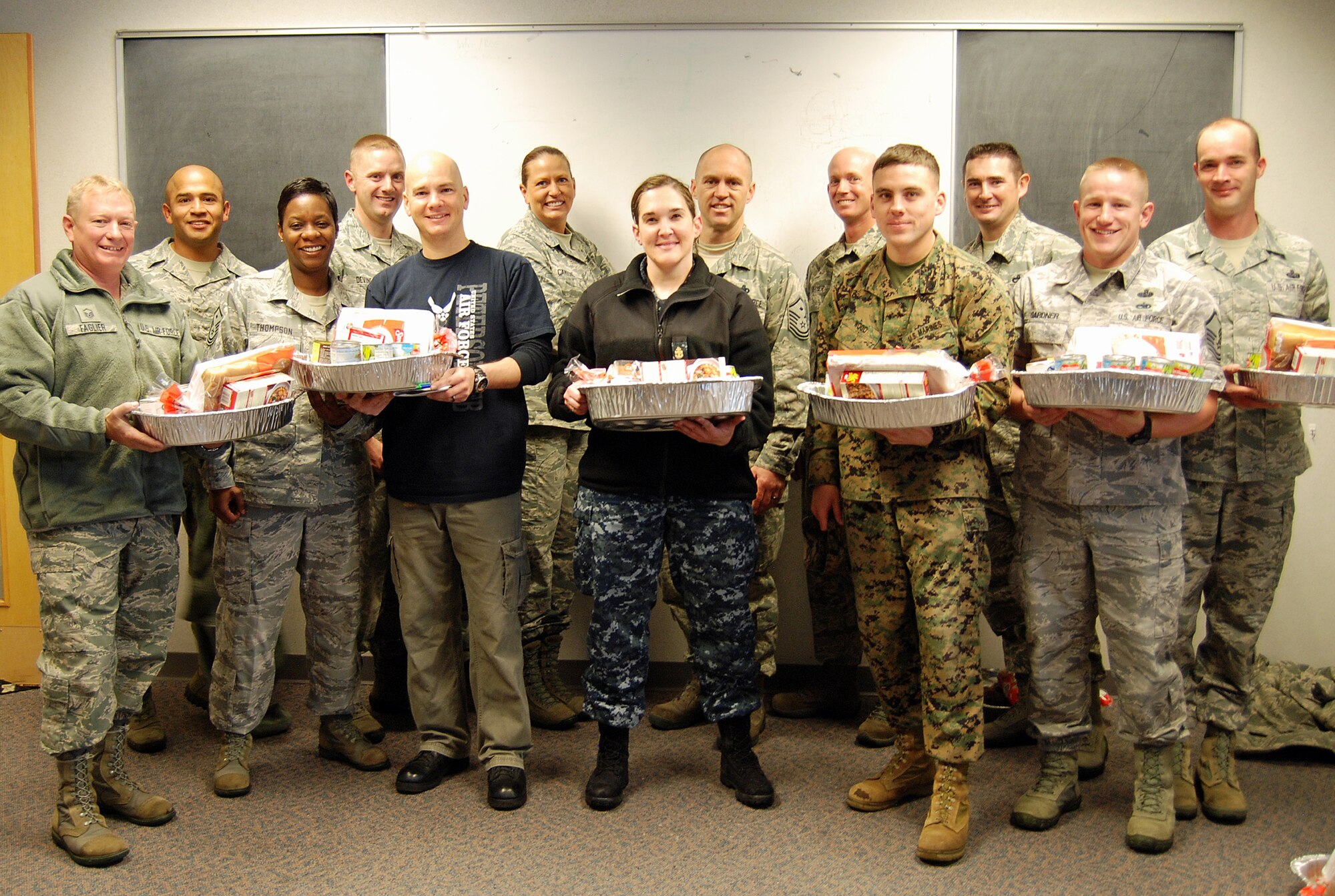 PETERSON AIR FORCE BASE, Colo. – Members of the Peterson Diamond Council, commissary, local vendors and parishioners at the base chapel raised nearly $8,900 in donations and funds to fill 233 Thanksgiving baskets to give to Peterson military families. Along with the basket, which included all the fixings and sides, members received a $25 commissary gift card to purchase the main course of their choosing. Unit representatives identified 233 families who could benefit from the assistance and worked with the Peterson Diamond Council to help them enjoy the holiday, regardless of rank, unit or branch of service. (U.S. Air Force photo/Michael Golembesky)