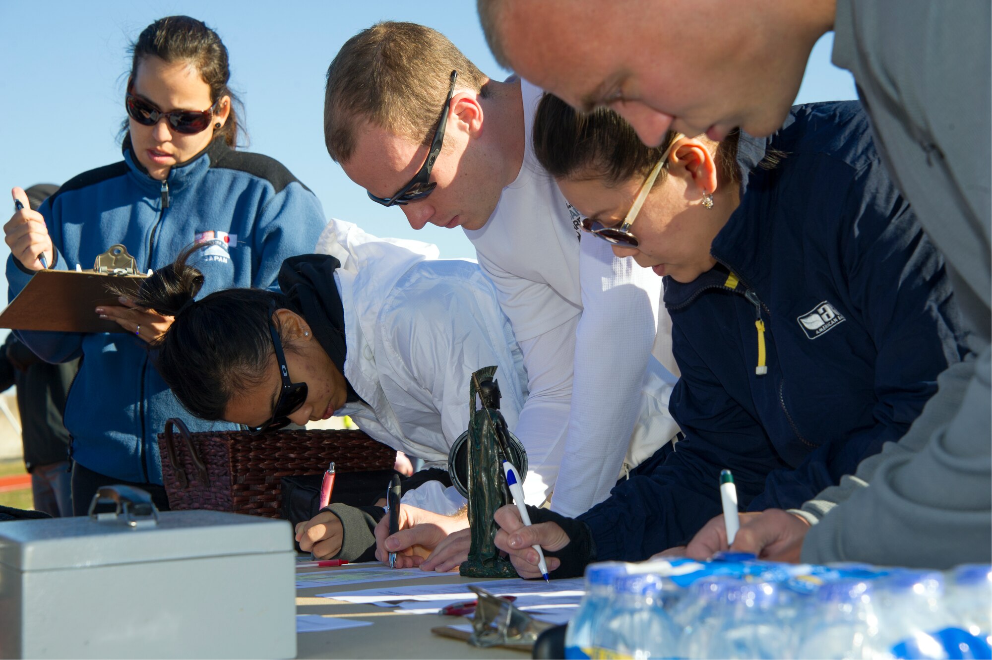 Keesler personnel register for participation in a 5km run Nov. 30, 2013, at Keesler Air Force Base, Miss.  The event, sponsored by the 333rd Training Squadron key spouses, was in support of the Philippine typhoon relief effort.  (U.S. Air Force photo by Adam Bond)