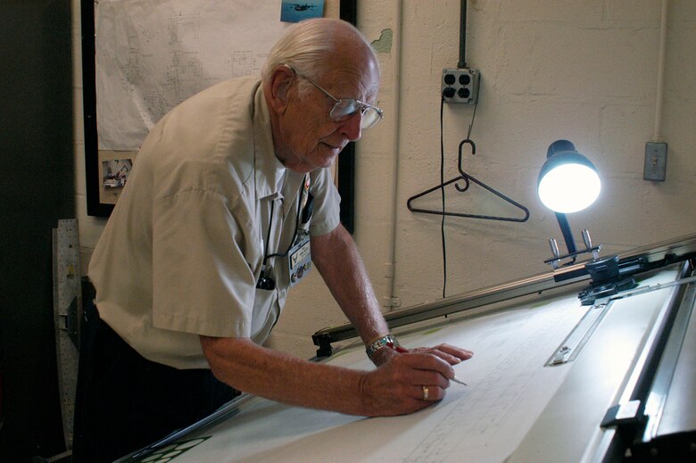 DAYTON, Ohio -- Draftsman Bill Denlinger's skills help the machinists manufacture needed part. (U.S. Air Force photo)