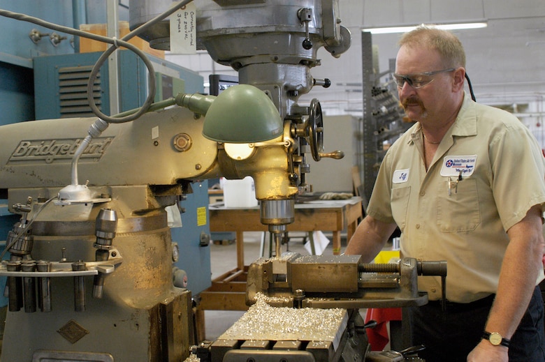 DAYTON, Ohio -- Jeff Helman volunteers as a machinist in addition to running his family's machine and tool business. (U.S. Air Force photo)