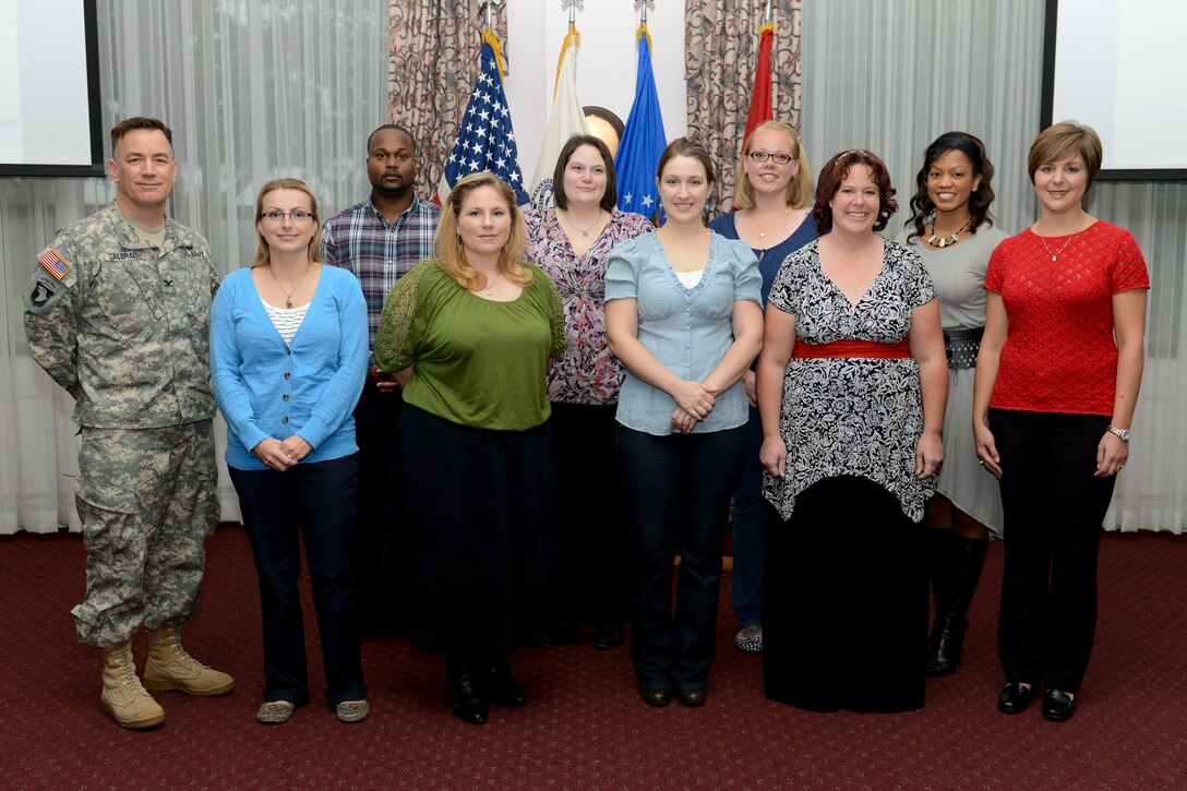 U.S. Army Col. William Galbraith, left, 733rd Mission Support Group commander, joins Volunteer of the Quarter winners at Fort Eustis, Oct. 23, 2013. More than 1,600 registered volunteers currently serve the installation in 31 organizations. (U.S. Air Force photo by Staff Sgt. Ciara Wymbs/Released) 