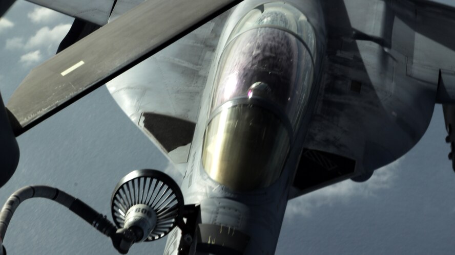 A U.S. Navy F/A-18 Super Hornet is refueled by a U.S. Air Force KC-135 Stratotanker from Kadena Air Base, Japan, Nov. 26, 2013. The 909th Aerial Refueling Squadron is one of only two aerial refueling squadrons in the Pacific region, which makes frequent joint training missions a necessity in retaining their skills. (U.S. Air Force photo by Airman 1st Class Todd Holly)