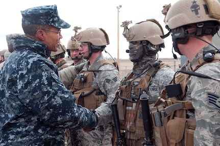 Adm. Cecil Haney, commander, U.S. Strategic Command, shakes hands with members of the 90th Security Forces Group Tactical Response Force Dec. 3, 2013, after the TRF team performed a missile alert facility recapture demonstration. Haney visited with Airmen from across the base during his visit, thanking them and stressing the importance of their contributions to our nation's nuclear deterrence mission. (U.S. Air Force photo by Rich Oriez)