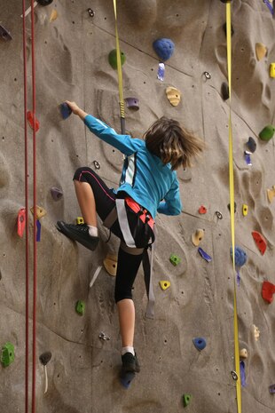 Marines and their families gather at the rock wall inside the AS-4400 gym aboard Marine Corps Air Station New River, as part of the Family Rock Wall Climbing Night, Nov. 22. The Family Rock Wall Climbing Night is hosted every Friday evening from 6-9 p.m. 