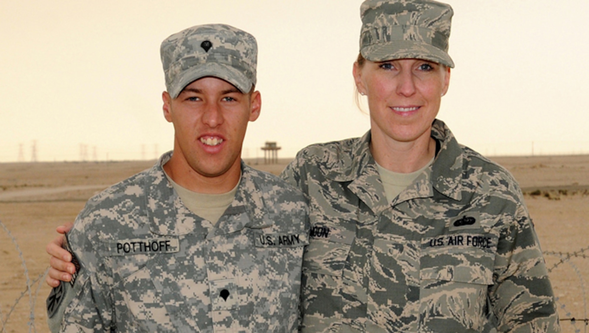 Master Sgt. Shanda Moon and her nephew, Army Spc. Alec Potthoff pose for a photo at their base in Southwest Asia where both are deployed. Moon is the executive assistant to the Command Chief, Air Force Central Command, and Potthoff is assigned to the 1st Battalion, 43rd Air Defense Artillery.  Moon and her nephew, Potthoff, recently had an unexpected reunion in the dining facility after more than five years apart.  