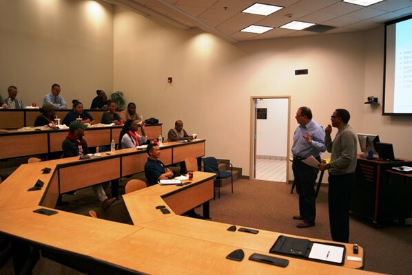 Tulsa District Chief of Natural Resources Kent Dunlap (standing left) and Tulsa District Mechanical Engineer Kendrick Adams talk to students and faculty of Langston University about STEM intern and career opportunities with the Corps during a Brown Bag Luncheon Nov. 20 at the university.                