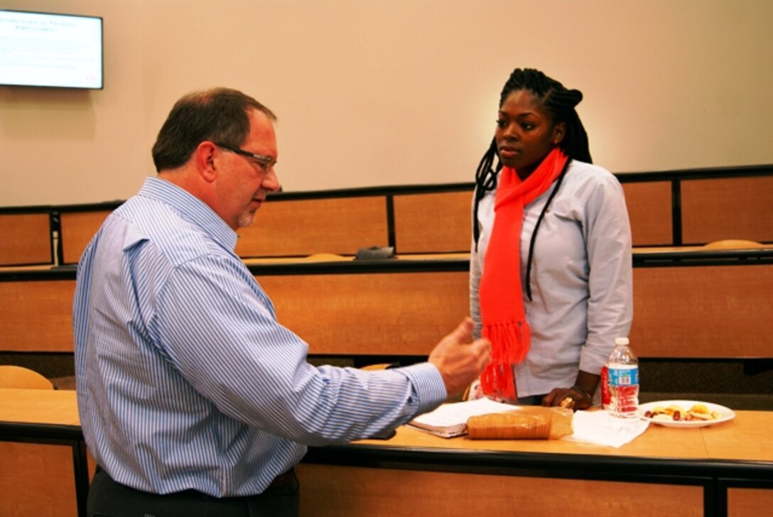 Tulsa District Chief of Natural Resources Kent Dunlap talks to a Langston University student about the various STEM internship and career opportunities with the Corps following a Brown Bag Luncheon at the university Nov. 20.              