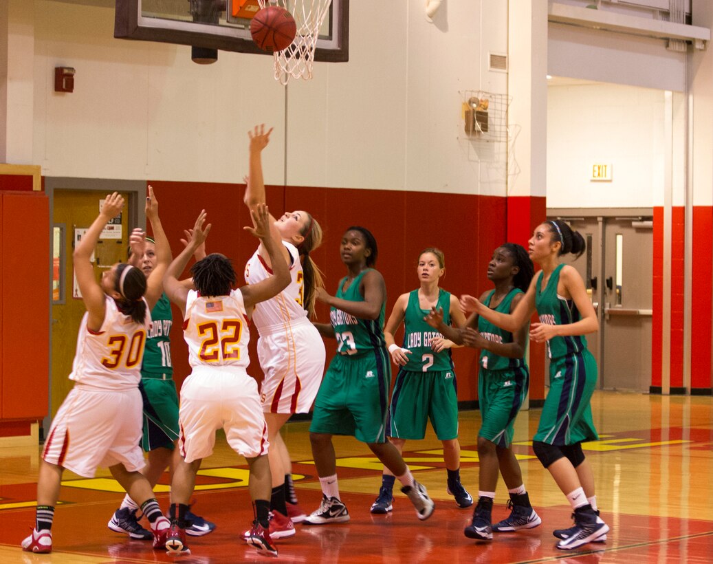 Lejeune High School’s DevilPups reach for a rebound during a girls’ varsity basketball game aboard Marine Corps Base Camp Lejeune, Nov. 26. The Devil Pups defeated Spring Creek High School’s Lady Gators with a score of 59-45.