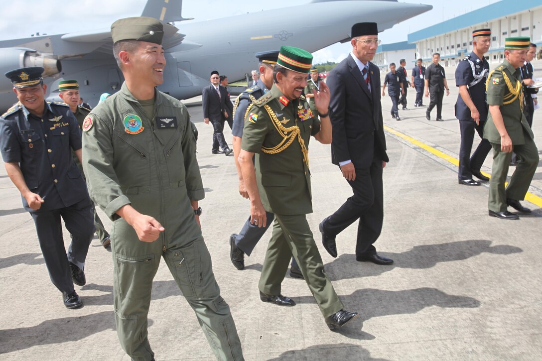 Lt. Col. Joseph S. Lee walks with the Sultan of Brunei Haji Hassanal Bolkiah Mu’izzaddin Waddaulah Dec. 3 at Rimba Air Base, Brunei, during the 4th Biennial Brunei Darussalam International Defense Exhibition and Conference. The five-day event includes displays and demonstrations of military equipment, with the theme of bridging the capability gap. BRIDEX 13 is an opportunity for communication and cooperation with regional partners and allies, builds strong multilateral relationships and enhances preparedness for disasters and other contingency operations. U.S. participation in BRIDEX 13 demonstrates cooperative engagement with Brunei and continued commitment to regional security and stability in the Asia-Pacific region. Lee is the executive officer of Marine Medium Tiltrotor Squadron 262, Marine Aircraft Group 36, 1st Marine Air Wing, III Marine Expeditionary Force.