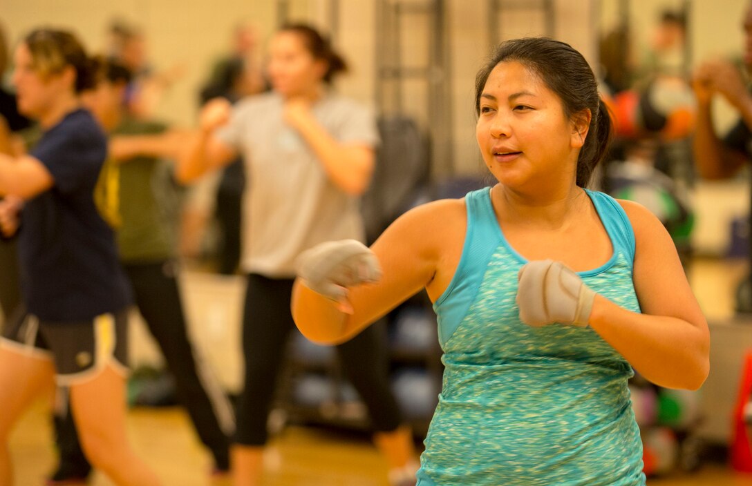 Linh Wheeler, a student at the Wallace Creak Fitness Center's Cardio Kickboxing class  performs a variety of fast paced jabs, Dec. 2. The Cardio Kickboxing class takes place Monday's at 11:30 a.m. as well as Tuesday's and Thursday's at 9:30 a.m.
