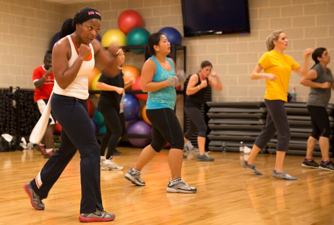 Students at Wallace Creak Fitness Center's Cardio Kickboxing class, including Lee Golden, a environmental protection specialist aboard Marine Corps Base Camp Lejeune,  perform a variety of fast paced kicks and jabs, Dec. 2. The Cardio Kickboxing class takes place Monday's at 11:30 a.m. as well as Tuesday's and Thursday's at 9:30 a.m.