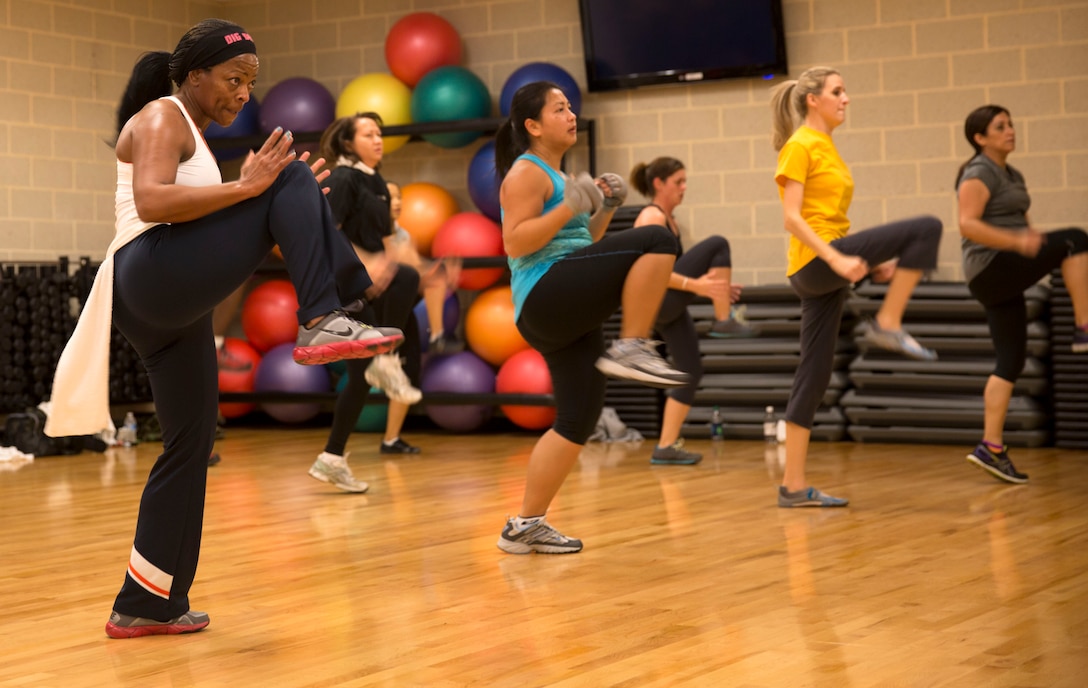 Students at Wallace Creak Fitness Center's Cardio Kickboxing class, including Lee Golden, a environmental protection specialist aboard Marine Corps Base Camp Lejeune,  perform a variety of fast paced kicks and jabs, Dec. 2. The Cardio Kickboxing class takes place Monday's at 11:30 a.m. as well as Tuesday's and Thursday's at 9:30 a.m.