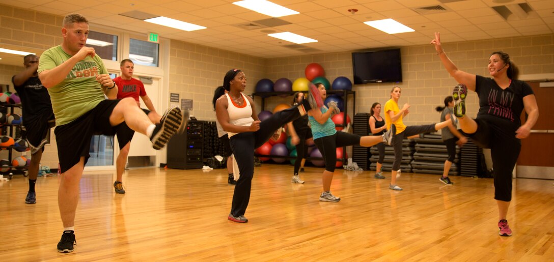 Students at Wallace Creak Fitness Center's Cardio Kickboxing class, including Lee Golden, a environmental protection specialist aboard Marine Corps Base Camp Lejeune,  perform a variety of fast paced kicks and jabs, Dec. 2. The Cardio Kickboxing class takes place Monday's at 11:30 a.m. as well as Tuesday's and Thursday's at 9:30 a.m.