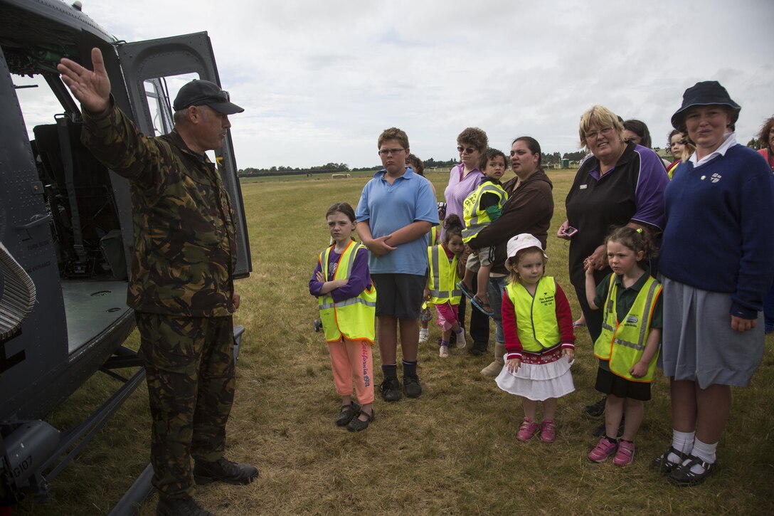 Royal New Zealand Air Force Flight Sgt. Mark Harpur, a maintenance controller with Royal New Zealand Air Force Squadron 3, gives a safety brief to guests during a guided tour as part of exercise Southern Katipo 2013 (SK13) at Timaru Airfield, Timaru, New Zealand, Nov. 21, 2013. SK13 is a New Zealand led training exercise that strengthens military relations between coalition forces and helps the New Zealand Defence Force further develop its amphibious capabilities. (U.S. Marine Corps photo by Cpl. Luis A. Vega/ Released) 