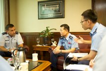 Maj. Gen. Won In-Choul, Vice Commander of Operations, Republic of Korea Air Force, with the assistance of his translator, Lt. Suh Jung Kyu (right), thanks Lt. Gen. Ted Kresge, Pacific Air Forces vice commander, for hosting the general and his staff during their office call Dec. 2, 2013, at PACAF Headquarters, Joint Base Pearl Harbor-Hickam, Hawaii. Won visited PACAF to get a better understanding of PACAF’s roles and responsibilities, and to discuss theater security cooperation and possible future interoperability opportunities. (U.S. Air Force photo by Staff Sgt. Matthew S. Bright) 