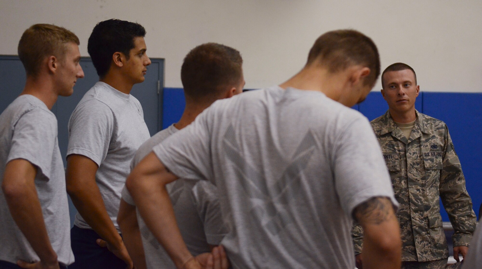 Tech Sgt. Ricardo Visconti, 36th Force Support Squadron Airman Leadership School instructor, speaks to his class regarding their performance as a team during a volleyball game Dec. 2, 2013, at the Coral Reef Fitness Center on Andersen Air Force Base, Guam. The “ALS versus Shirts” volleyball game between ALS students and first sergeants is an Air Force-wide tradition. The 36th Wing first sergeants defeated the ALS students, 3-1 sets. (U.S. Air Force photo by Senior Airman Marianique Santos/Released)