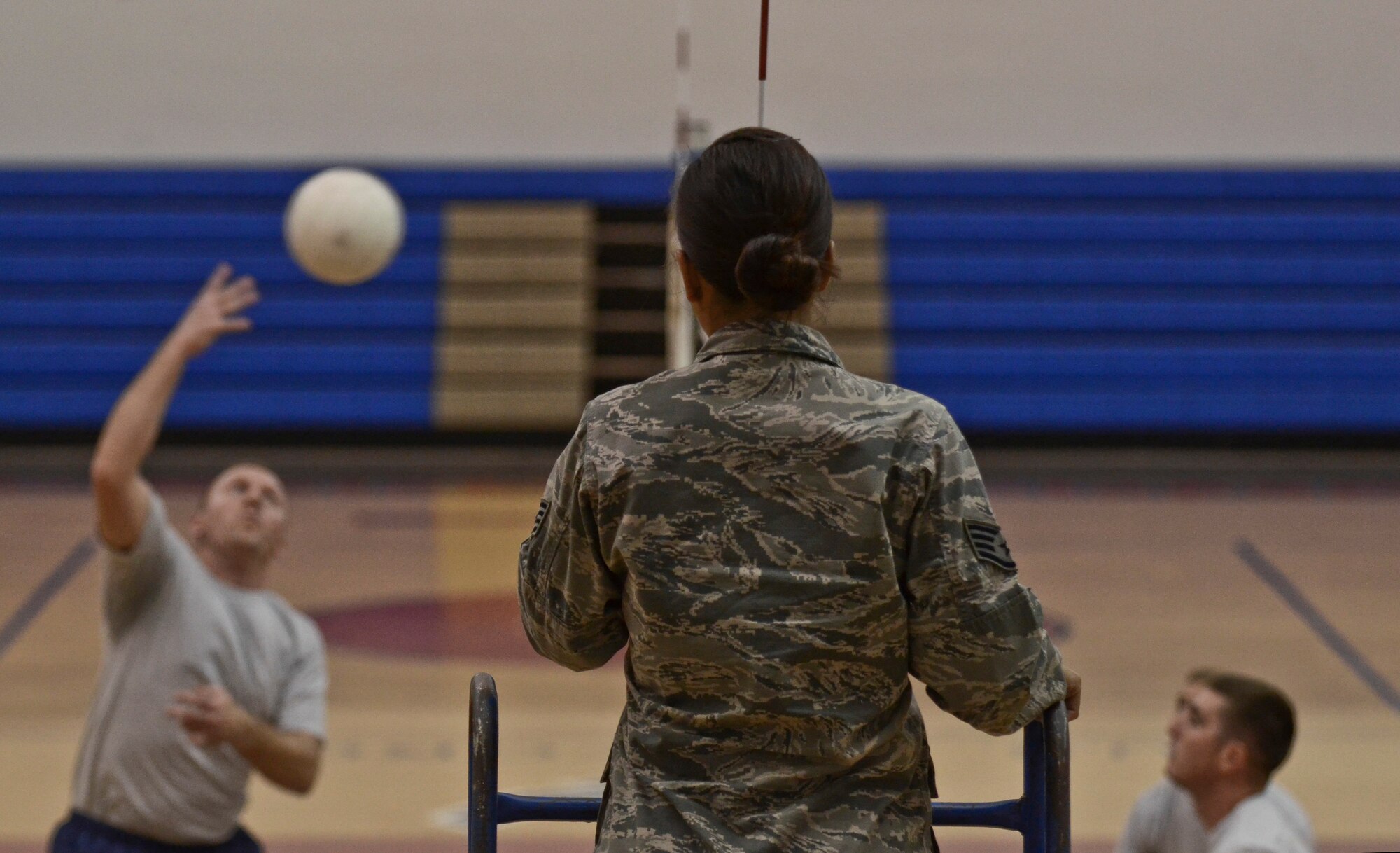 Staff Sgt. Kamaile Long, 36th Force Support Squadron Airman Leadership School instructor, referees a volleyball game Dec. 2, 2013, at the Coral Reef Fitness Center on Andersen Air Force Base, Guam. The “ALS versus Shirts” volleyball game between ALS students and first sergeants is an Air Force-wide tradition. The 36th Wing first sergeants defeated the ALS students, 3-1 sets. (U.S. Air Force photo by Senior Airman Marianique Santos/Released)
