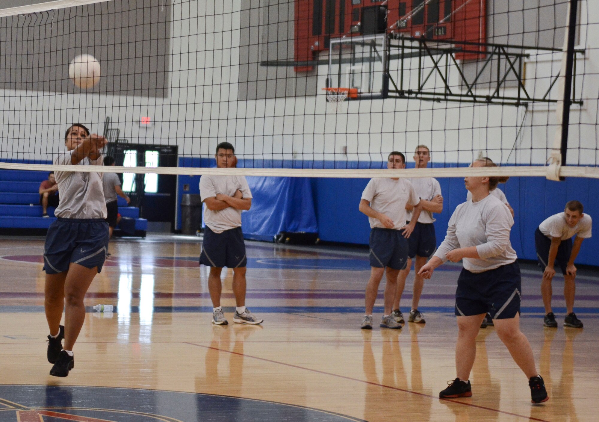 Shondelle Ah Kuoi, current Airman Leadership School student from the 36th Medical Operations Squadron bumps the volleyball during a game Dec. 2, 2013, at the Coral Reef Fitness Center on Andersen Air Force Base, Guam. The “ALS versus Shirts” volleyball game between the students and first sergeants is an Air Force-wide tradition. The 36th Wing first sergeants defeated the ALS students, 3-1 sets. (U.S. Air Force photo by Senior Airman Marianique Santos/Released)