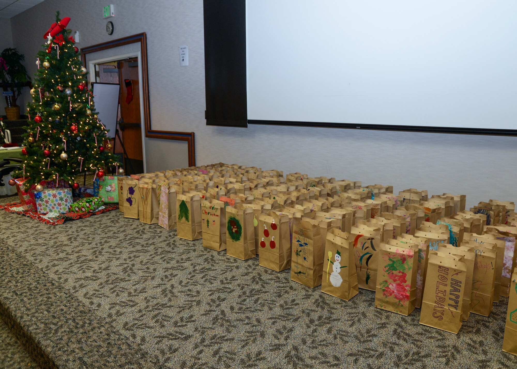 Each paper bag filled with cookies was decorated by children at the Child Development Center. (U.S. Air Force photo by Rebecca Amber)