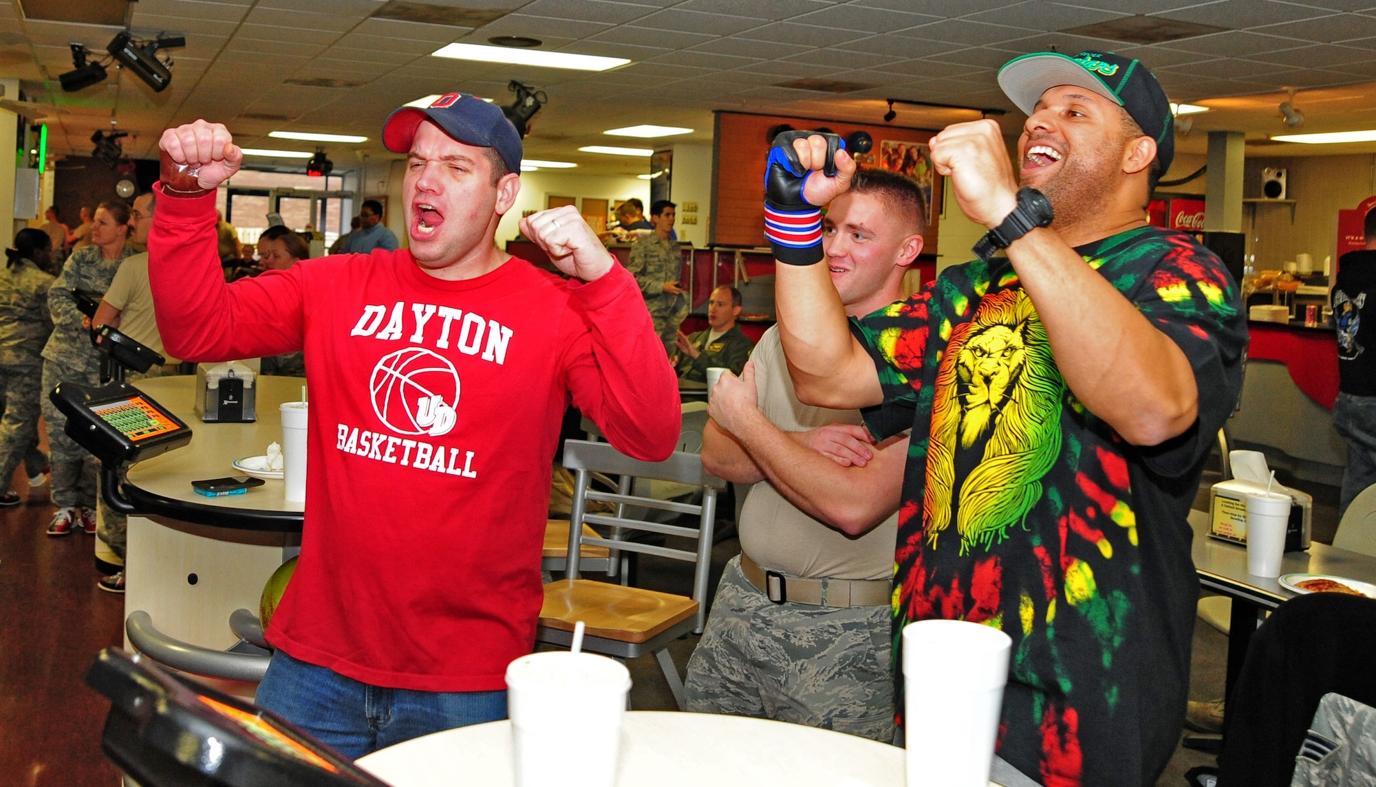 U.S. Air Force Tech. Sgt. Douglas Kraft, 509th Operations Support Squadron NCO in charge of Quality Assurance, and U.S. Air Force Tech. Sgt. Damian Bunch, 509th OSS aircrew flight equipment training manager, celebrate as one of their bowling teammates scores a strike during a fundraiser for the Combined Federal Campaign at the Stars and Strikes Bowling Alley on Whiteman Air Force Base, Mo., Nov. 22, 2013. More than 60 people attended the event which raised $921. Each year, the CFC allows Service members and civilians to make monetary contributions to their choice of more than 1,800 agencies, charities and organizations. CFC ends Dec. 15, 2013.  (U.S. Air Force photo by Staff Sgt. Nick Wilson/Released)