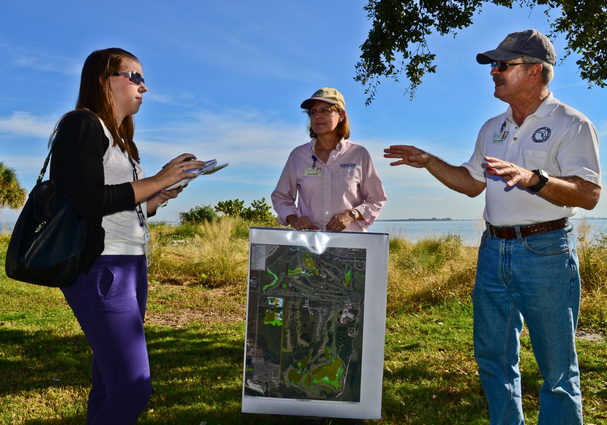Brandt F. Henningsen, SWIM program chief environmental scientist explains MacDill’s recent restoration project to Elizabeth Behrman, Tampa Tribune staff writer, Dec. 4, 2013 on MacDill Air Force Base. The five month project restored 26 acres of wetlands, created 22 acres of new wetlands, and enhanced nearly 72 acres of wetland, surface water, and upland habitats. (U.S. Air Force photo by Airman 1st Class Ned T. Johnston/Released)
