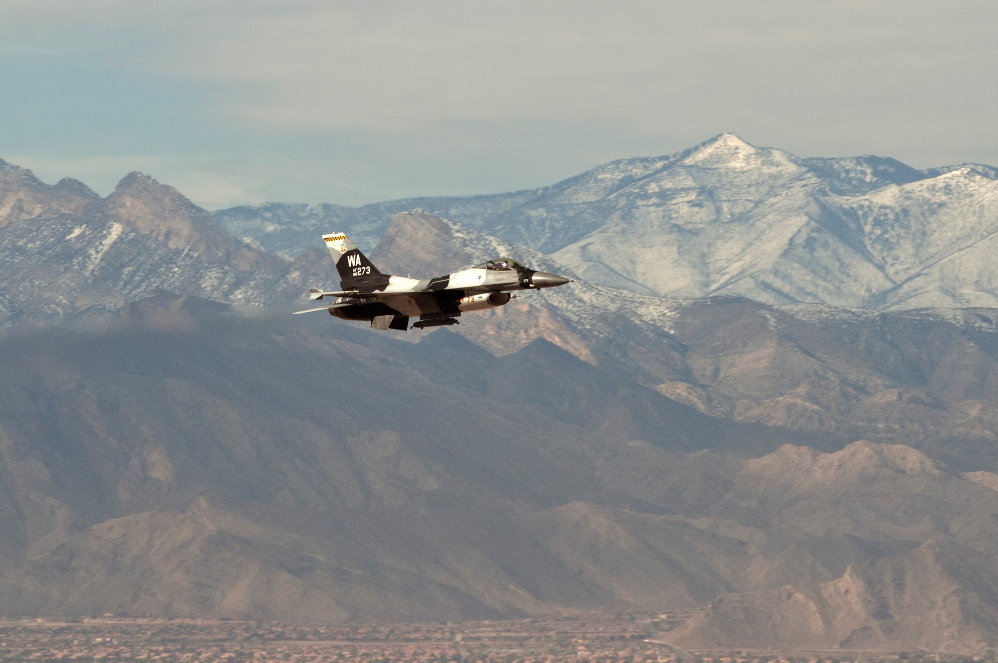 An F-16 Fighting Falcon assigned to the 64th Aggressors Squadron, takes off Nov. 27, 2013, at Nellis Air Force Base, Nev. Pilots assigned to the 64th AGRS utilize adversary tactics and simulate hostile forces during air-combat exercises. (U.S. Air Force photo by Airman 1st Class Monet Villacorte)
