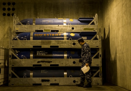 Petty Officer 2nd Class Noah Kalemkiewicz, Navy Munitions Command Unit Charleston quality assurance inspectors, checks the storage condition of ordnance the inside of a magazine Nov. 21, 2013, at Joint Base Charleston – Weapons Station, S.C. The quality assurance inspectors make sure the ordnance inside the magazines are maintained year round and were given a satisfactory during the Explosive Safety Inspection on Nov. 21. (U.S. Air Force photo/ Senior Airman Dennis Sloan)