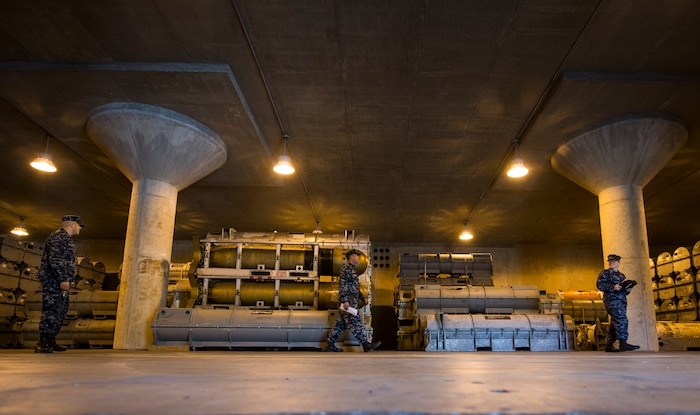 Navy Munitions Command Unit Charleston quality assurance inspectors check the condition of the inside of a magazine Nov. 21, 2013, at Joint Base Charleston – Weapons Station, S.C. The quality assurance inspectors make sure the magazines are maintained year round and were given a satisfactory during the Explosive Safety Inspection on Nov. 21. (U.S. Air Force photo/ Senior Airman Dennis Sloan)