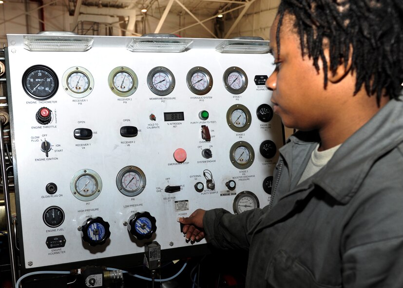 Airman 1st Class Toni Petty, 307th Aerospace Ground Equipment journeyman, turns on a self-generating nitrogen cart on Barksdale Air Force Base, La., Dec. 3, 2013. Petty fixed a leak on a float inside the fuel tank of the SGNC. The float was filled with fuel, sinking it to the bottom of the tank, which kept the fuel gauge at empty. (U.S. Air Force photo/Senior Airman Joseph A. Pagán Jr.)