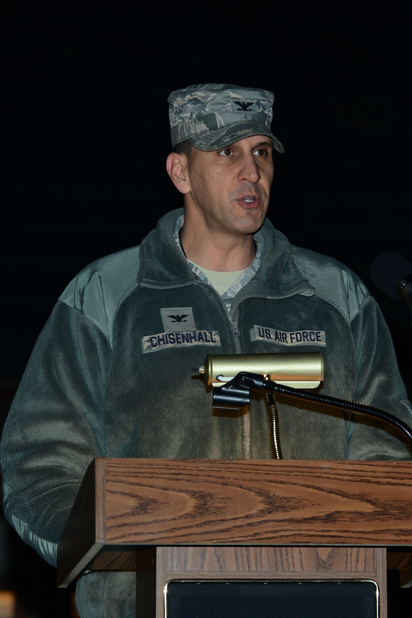 U.S. Air Force Col. David Chisenhall, 633rd Mission Support Group commander, provides remarks during the annual Christmas tree lighting ceremony at Langley Air Force Base, Va., Dec. 3, 2013. This year marks the 46th year of the ceremony, which was held on the chapel lawn. (U.S. Air Force photo by Airman 1st Class Kimberly Nagle/Released)