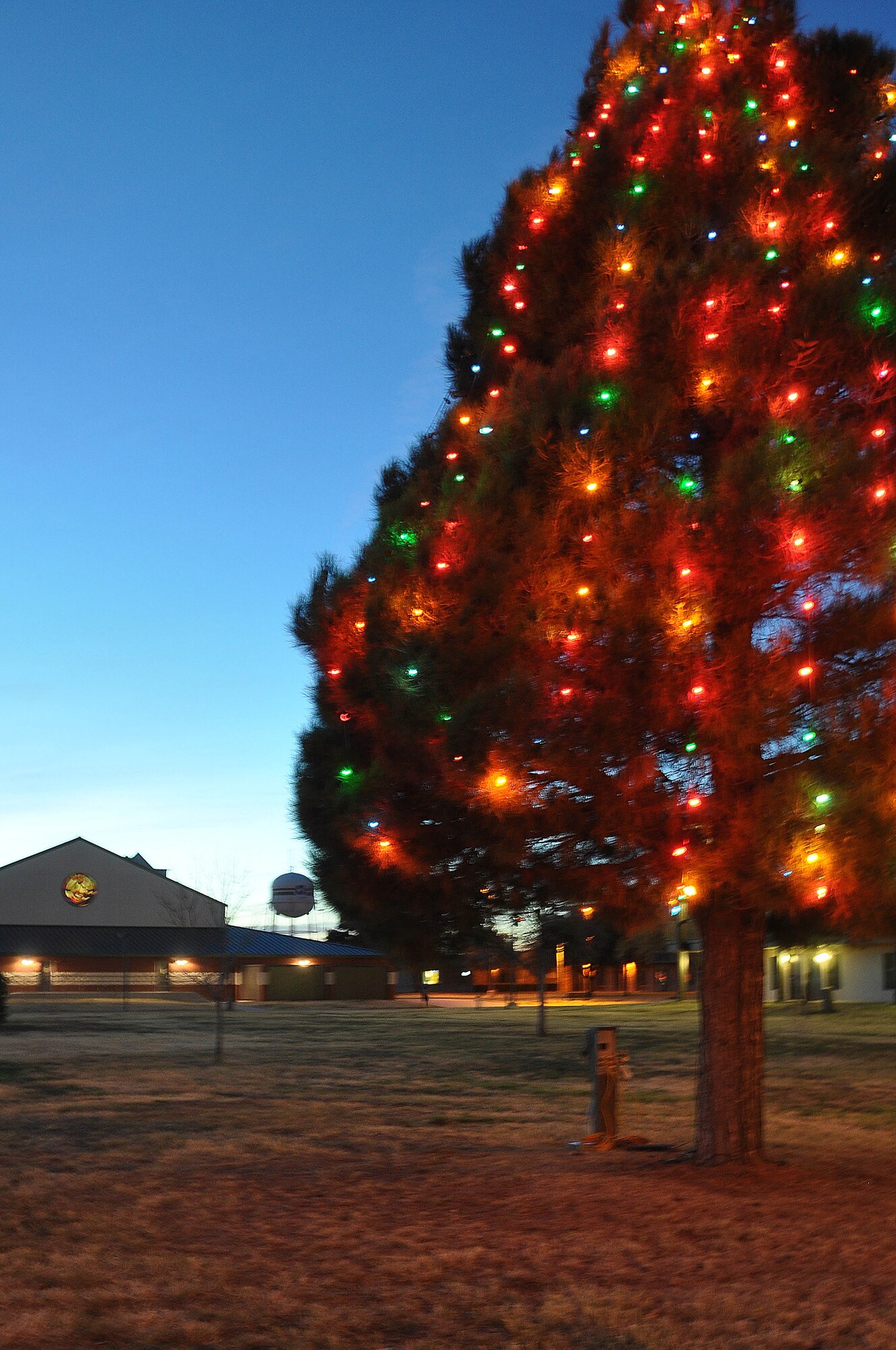GOODFELLOW AIR FORCE BASE, Texas – A holiday tree glows outside of the base chapel after the Holiday Tree Lighting Ceremony at the Chapel Dec. 3. This traditional ceremony marks the start of the base winter holiday season. (U.S. Air Force photo/ Airman 1st Class Breonna Veal)