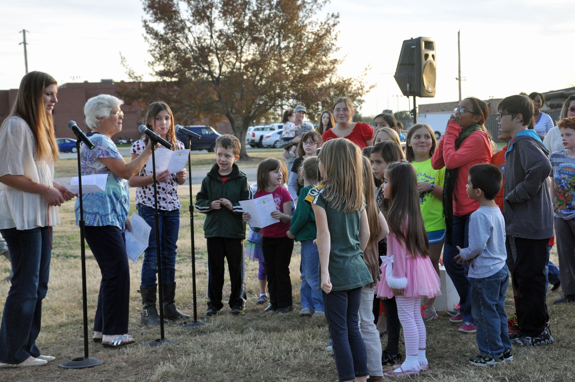 GOODFELLOW AIR FORCE BASE, Texas – Military children sing carols during the Holiday Tree Lighting Ceremony at the base chapel Dec. 3. Team Goodfellow service members and families sang “Santa Claus is Coming to Town” as an invitation for Santa to come to the Chapel. (U.S. Air Force photo/ Airman 1st Class Breonna Veal)
