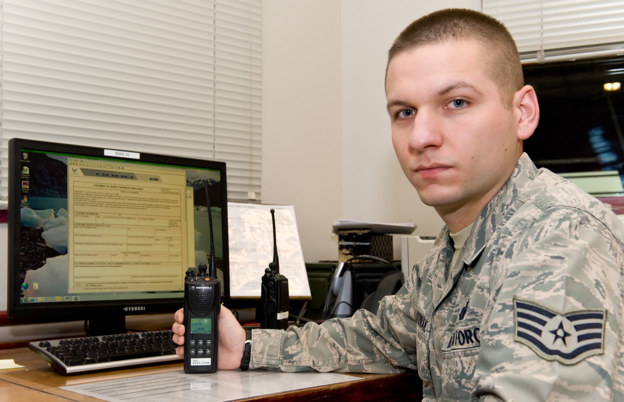 Staff Sgt. Ted Wozniak, 436th Security Forces Squadron base defense operations center controller and installation patrolman, monitors a radio Nov. 27, 2013, at Dover Air Force Base, Del. Wozniak was named Air Mobility Command's winner of the 2013 Outstanding Security Forces Flight-Level Noncommissioned Officer Award. (U.S. Air Force photo/Roland Balik)

