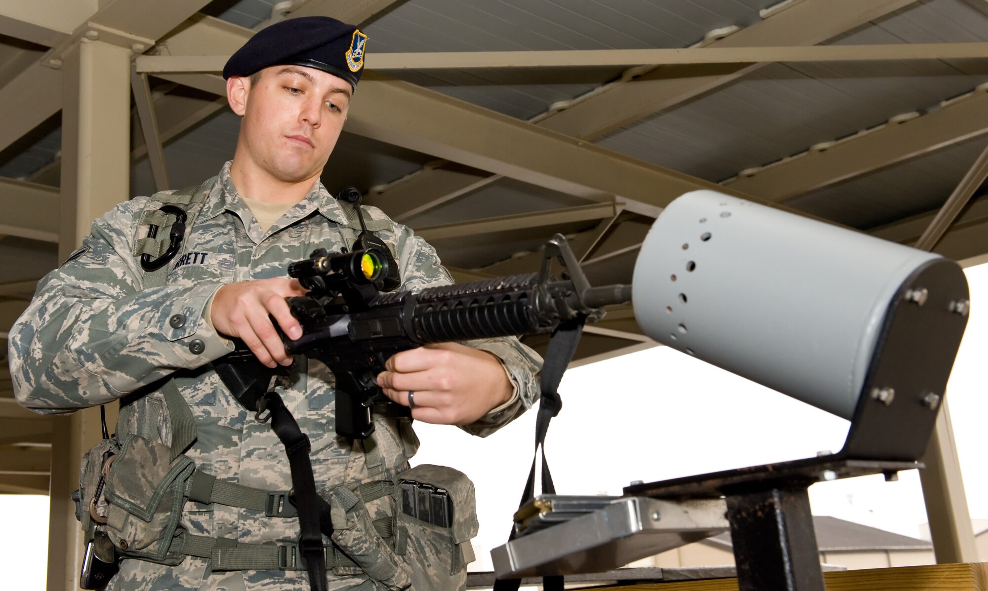 Senior Airman Justin Jarrett, 436th Security Forces Squadron response force leader, clears his weapon at the 436th SFS armory Nov. 27, 2013, at Dover Air Force Base, Del. Jarrett was named Air Mobility Command's winner of the 2013 Outstanding Security Forces Flight-Level Airman Award. (U.S. Air Force photo/Roland Balik)
