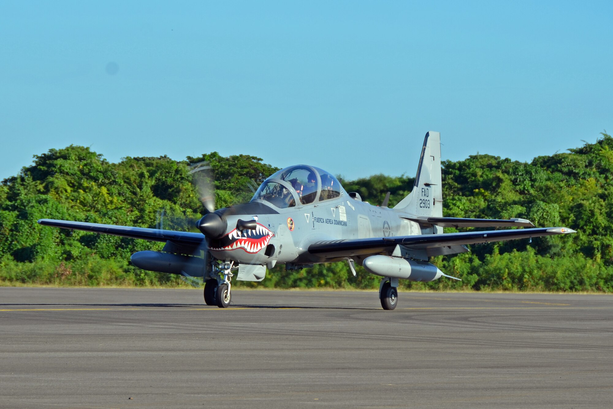 A Dominican Republic air force A-29 Super Tucano pilot taxis after a mission as part of an exercise to combat illegal drug trafficking Dec. 3, 2013, over the skies of the Caribbean. The exercise is part of the Sovereign Skies Program, an initiative between the U.S., Colombian, and Dominican Republic air forces to share best-practices on procedures to detect, track and intercept illegal drugs moving north from South America. (U.S. Air Force photo by Capt. Justin Brockhoff/Released)











