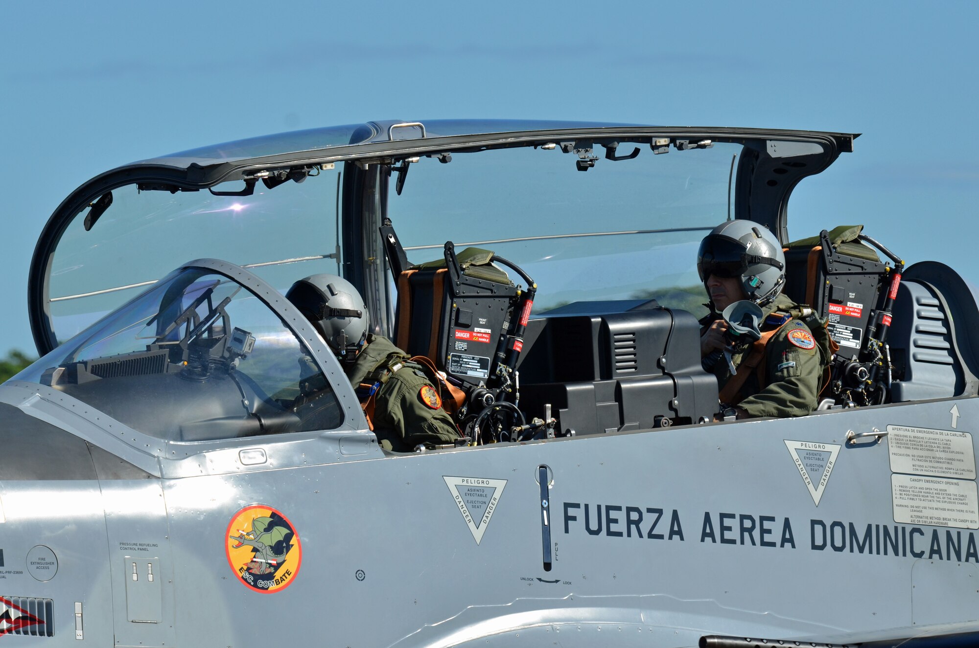 Lt. Col. Eric Perlman, U.S. Air Force F-16 instructor pilot, prepares to ride in the back seat of a Dominican Republic air force A-29 Super Tucano as part of an exercise to combat illegal drug trafficking Dec. 3, 2013. The exercise is part of the Sovereign Skies Program, an initiative between the U.S., Colombian, and Dominican Republic air forces to share best-practices on procedures to detect, track and intercept illegal drugs moving north from South America. (U.S. Air Force photo by Capt. Justin Brockhoff/Released)


