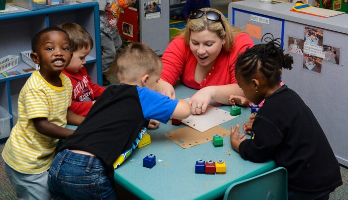 Pre-kindergarten children play after the Thanksgiving lunch held by the Child Development Center Nov. 21, 2013, at Joint Base Charleston – Air Base, S.C. The CDC has held this event for more than 16 years. The children and their parents enjoyed turkey, dressing, candy yams, green beans, rolls and apple and potato pie. (U.S. Air Force photo/ Airman 1st Class Chacarra Neal)