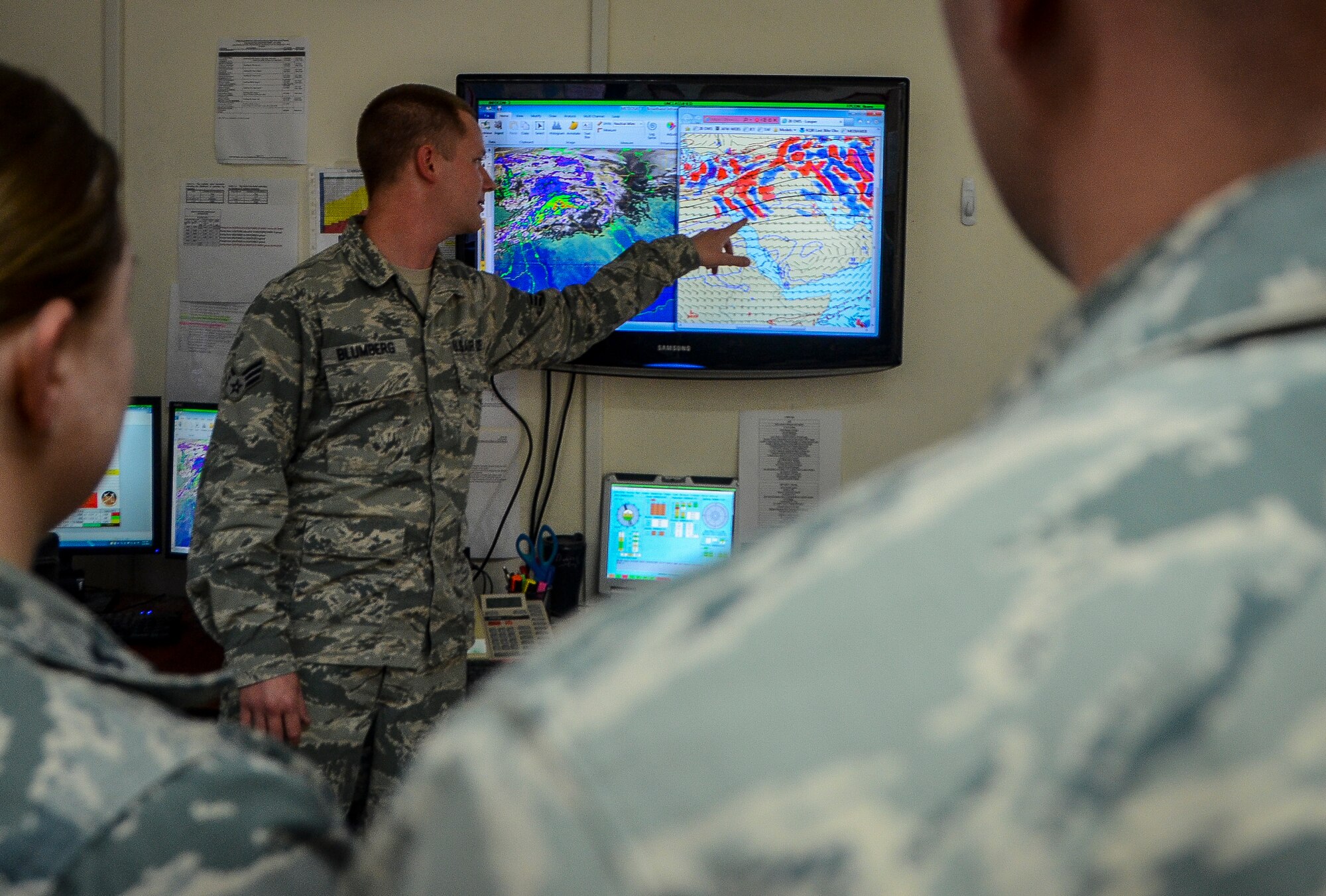 Senior Airman Chase Blumberg briefs a weather chart to his flight at the 379th Air Expeditionary Wing in Southwest Asia, Dec. 2, 2013. To avoid harsh weather conditions and create the safest route possible, weather forecasts help pilots during takeoff, in flight and when landing. Blumberg, a 379th Expeditionary Operations Support Squadron weather flight forecaster, is part of an eight man shop which monitors weather conditions for flight missions around-the-clock. Blumberg is deployed from Davis-Monthan Air Force Base, Ariz. and hails from Ocala, Fla. (U.S. Air Force photo/Senior Airman Jared Trimarchi) 